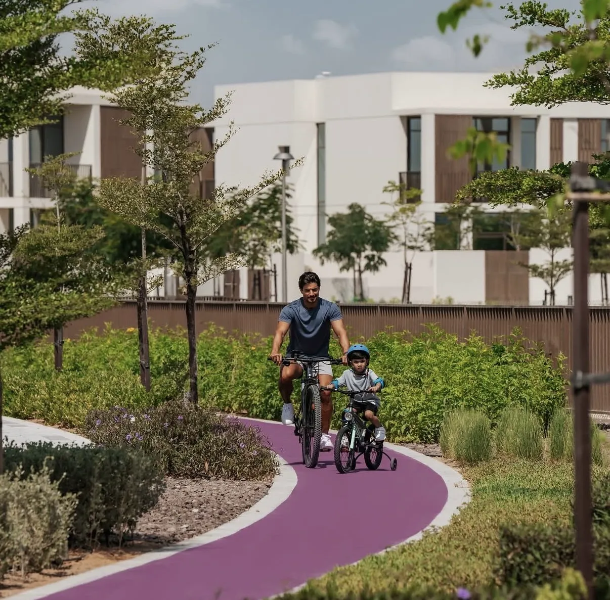 Lifestyle scenario — family cycling along a Dubai community path